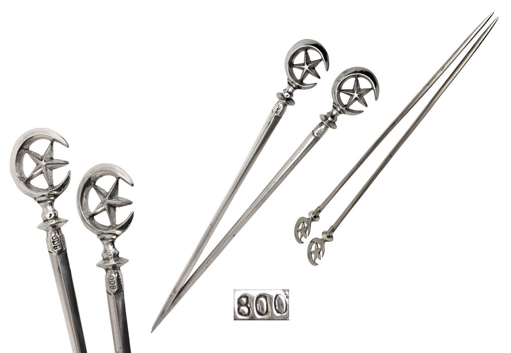 A pair of silver skewers