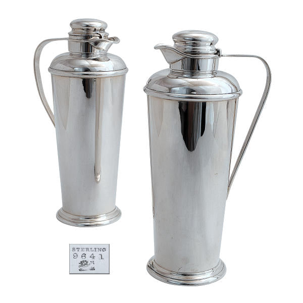 A pair of silver cocktail shakers